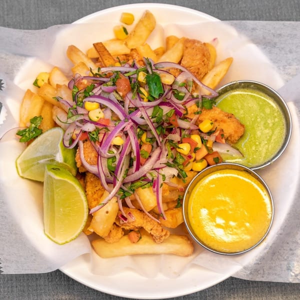Peruvian fried seafood and fries topped with red onion, corn, and cilantro, served with two sauces.